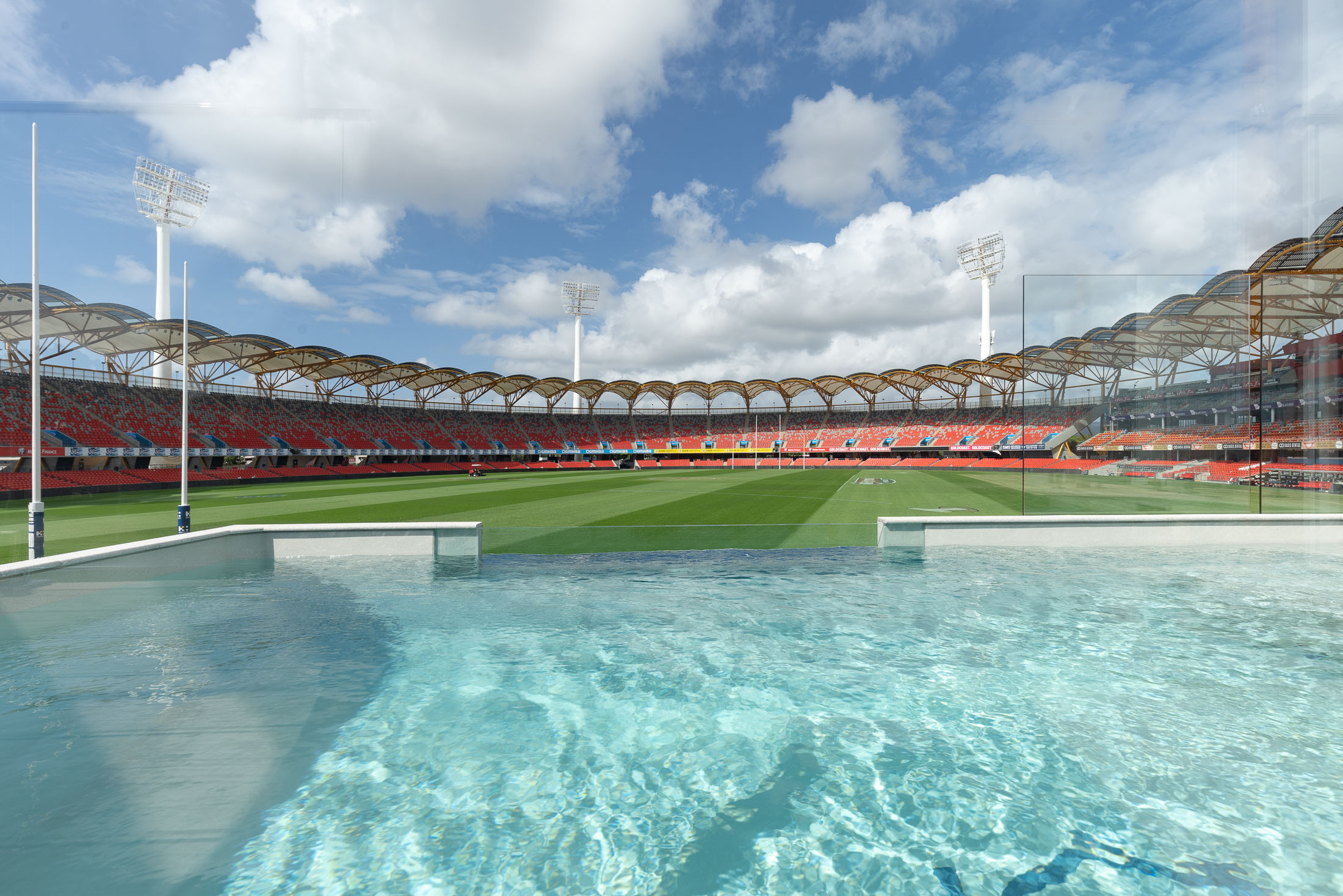 20ft x 10ft Plungie Max in Sahara Sand, overlooking Metricon Stadium